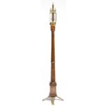 An early 18th century style walnut and brass portable stick barometer after Daniel Quare, the