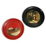 Two late 19th century Russian papier-mache plates by Lukutin, one black lacquer, the centre