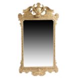A George II giltwood wall mirror, the later arched rectangular bevelled plate within a moulded