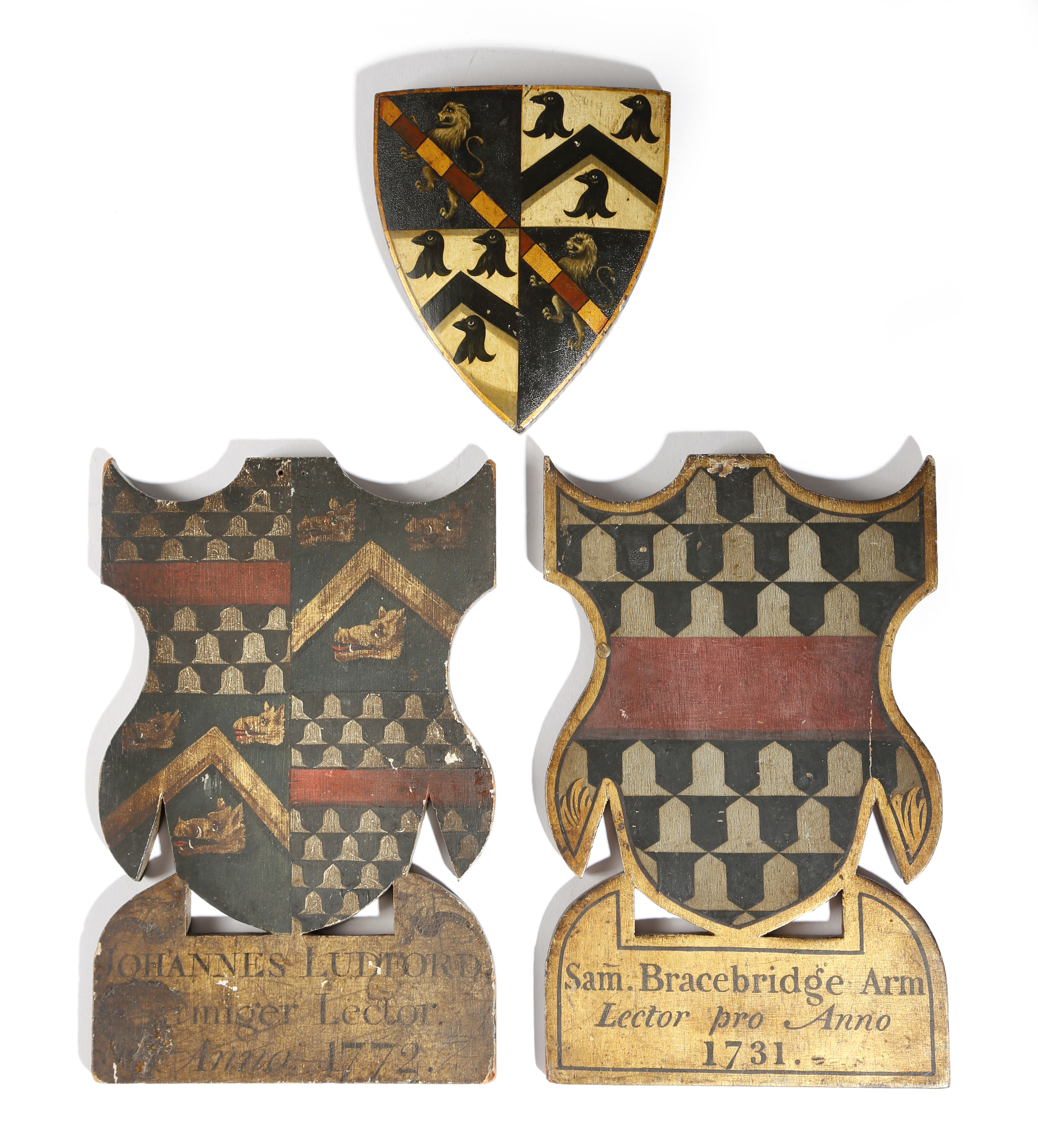 Heraldry interest. Three carved and painted wood coats of arms, parcel gilt, two with