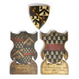 Heraldry interest. Three carved and painted wood coats of arms, parcel gilt, two with