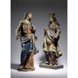 Two European carved wood and polychrome decorated figures of the Virgin Mary, with parcel gilt