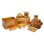 A collection of Russian karelian burr birch boxes, including: a tea caddy, a sarcophagus shape