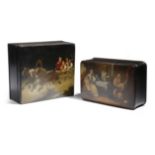 Two late 19th century Russian black lacquer papier-mache boxes, each painted with a troika scene,