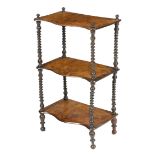 A Victorian walnut three-tier whatnot, with a serpentine front and spiral twist supports, 88cm high,