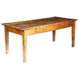 A 19th century French cherrywood farmhouse kitchen table, the boarded top with cleated ends, with