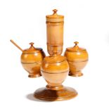 A Victorian treen boxwood cruet, with four lidded condiment and salt holders and with a spoon, 15.
