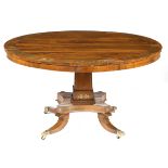 λ A Regency rosewood and brass marquetry centre table, the crossbanded top decorated with panels