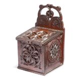 A late Victorian stained pine chip carved salt box, the pierced gallery inscribed 'C E EIGHTEEN
