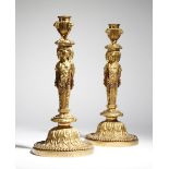 A pair of 19th century French ormolu candlesticks after a design by Jean-Demosthene Dugourc, each