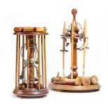 Two late Victorian table croquet sets, each with a mahogany stand supporting mallets, balls and