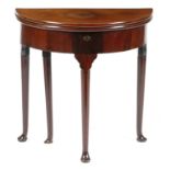 A George II red walnut demi-lune tea table, the twin hinged top revealing a vacant interior and on a
