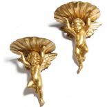 A pair of 19th century Italian giltwood wall brackets in Baroque style, each in the form of a winged