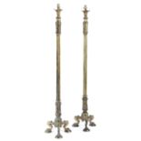 A pair of brass standard lamps in Regency style, with leaf and rosette decoration, with fluted