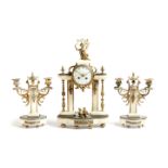 A late 19th century French marble and ormolu mounted clock garniture, the eight day brass cased drum