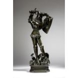 An early 20th century French bronze group of St. George and the dragon, the plinth base signed '