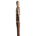 An East African carved hardwood walking stick, the handle carved as an Askari soldier, early 20th