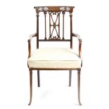 λ A late Victorian mahogany and brass inlaid open armchair, the scroll top rail centred