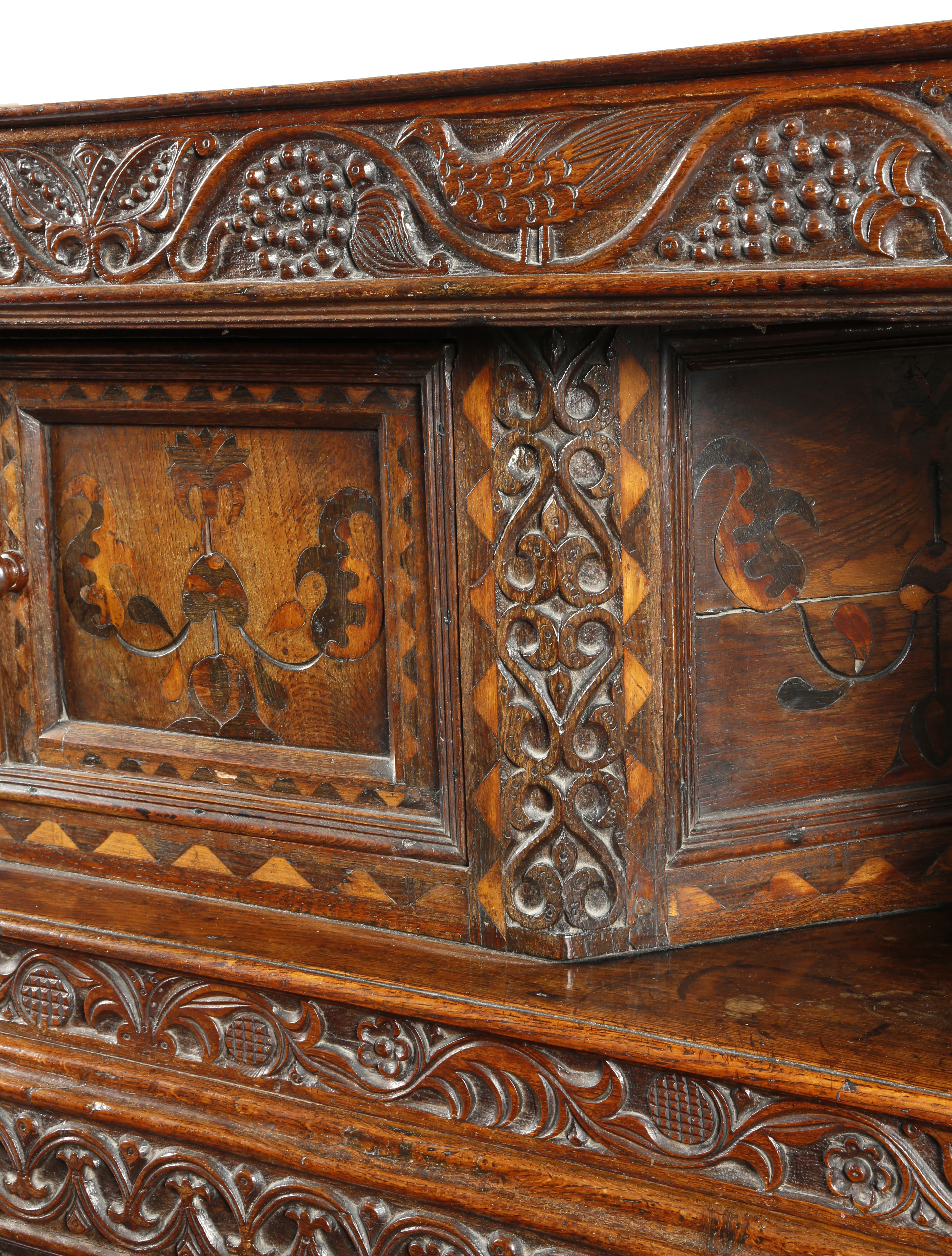 A Welsh oak and marquetry press cupboard, inlaid with parquetry banding, the frieze naively carved - Image 2 of 3