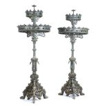 A pair of large Gothic style painted cast iron candelabra, with thirty-one candle holders, decorated