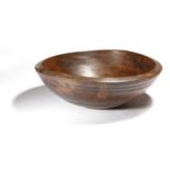 A Victorian treen turned sycamore dairy bowl, 16cm high, 45.6cm diameter.