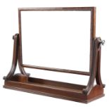 A George IV mahogany toilet mirror in the manner of Gillows, with a rectangular plate and fluted