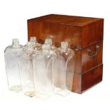 An early George III mahogany decanter box, the hinged lid revealing six tapering glass decanters,