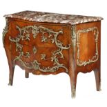 A kingwood bombe commode in Louis XV style, with scrolling leaf ormolu mounts, the serpentine marble