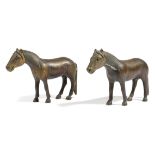 A pair of bronze models of horses, possibly Chinese, 11.8cm high, 16.5cm long. (2)