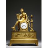 An Empire ormolu mantel clock by Claude Galle, the eight day brass cased drum movement with an