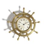 A novelty brass ship's wheel wall clock, with a lever escapement, the silvered dial with Roman