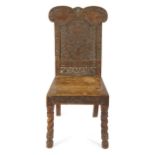 A George IV Scottish ash hall chair by G. Troup, carved with game birds, leaves, flowers,