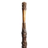 A Victorian folk art briar walking cane, carved in the form of an umbrella, 76.7cm long.