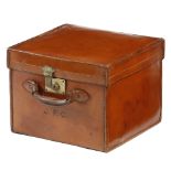 A brown leather hat box, with space for three hats, impressed with initials 'J. F. C.', with a brass