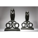 ‡A pair of Art Deco patinated bronze owl andirons attributed to Edgar Brandt (French 1880-1960),