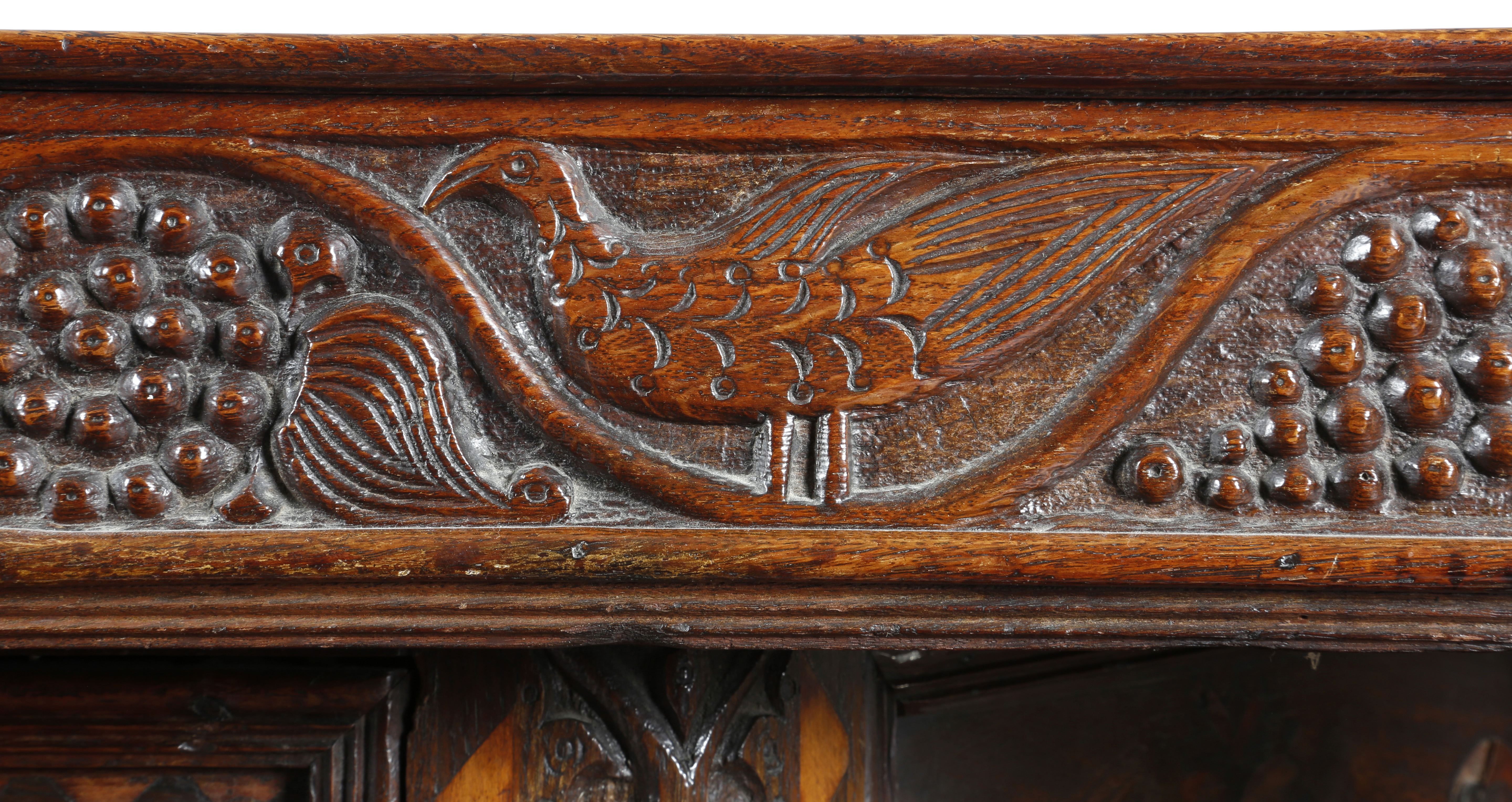 A Welsh oak and marquetry press cupboard, inlaid with parquetry banding, the frieze naively carved - Image 3 of 3