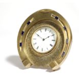 A novelty French brass clock, in the form of a horseshoe, the movement with a lever escapement and