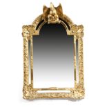 An 18th century giltwood wall mirror, the later arched plate with further marginal plates, within