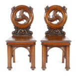 A pair of Victorian Scottish oak hall chairs in Pugin style by Wylie & Lochhead, each with a