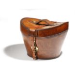 A brown leather bucket shape hat box by Greaves, with brass mounts and with a green silk lined