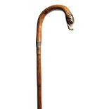 A late Victorian bamboo walking cane, the shepherd's crook handle carved and painted with the head