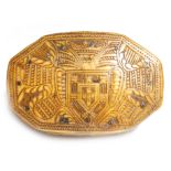 An 18th century horn snuff box, the hinged lid relief carved with a cartouche and a coat of arms,