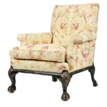 A black japanned and parcel gilt armchair in 18th century style, the padded back above scroll