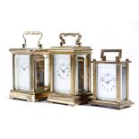 Three miniature brass carriage clocks, the dial of one inscribed 'PIERRE JACOT PARIS', one with