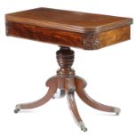A George IV mahogany tea table, the hinged and swivel top with a reeded edge, on a ring turned stem,