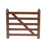 A late Victorian oak novelty stick rack by Swaine & Adeney, in the form of a five bar gate,
