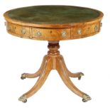 An early 19th century mahogany drum table, the circular revolving top inlaid with green gilt