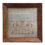 A George IV needlework sampler by Mary Hardcastle, worked in various colours, with Adam and Eve