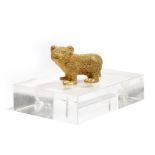 A 19th century Russian gilt bronze model of a bear cub, 7cm long, later mounted on a Perspex base.