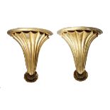 A pair of 19th century giltwood wall brackets, each with a fan shaped support, with shell